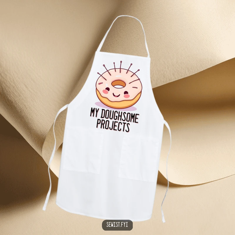 Funny apron featuring a cheerful donut with sewing needles in its frosting, practical and humorous for bakers and crafters alike.