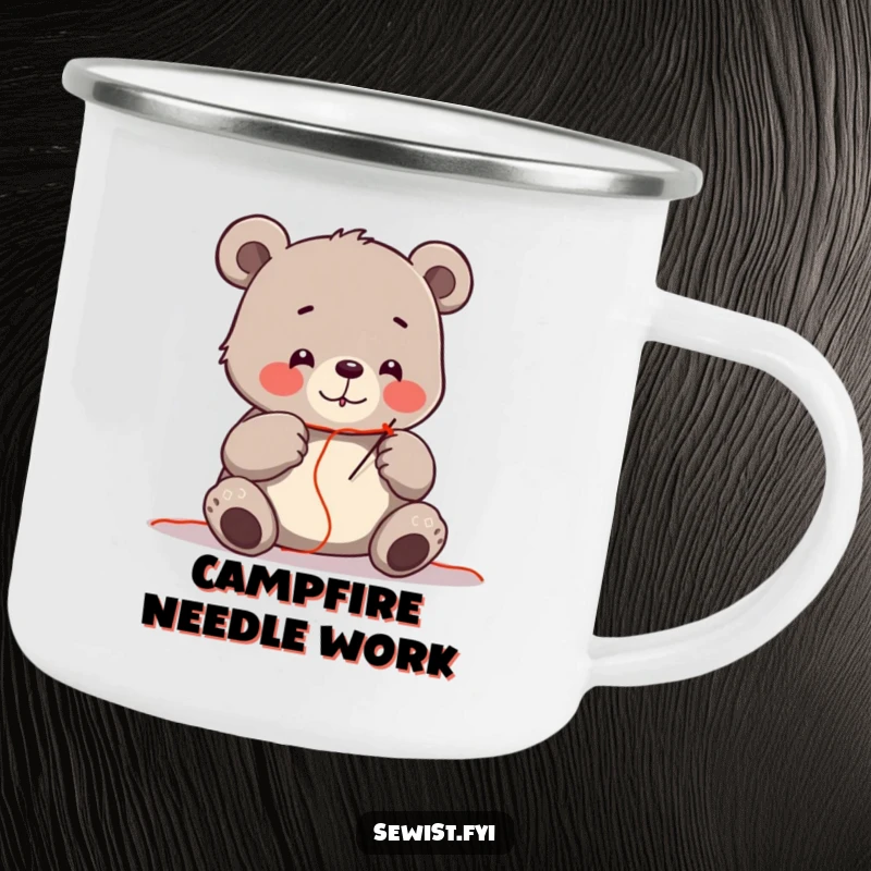 Funny camping mug with a cheerful bear carefully threading a needle, perfect for outdoor crafters.