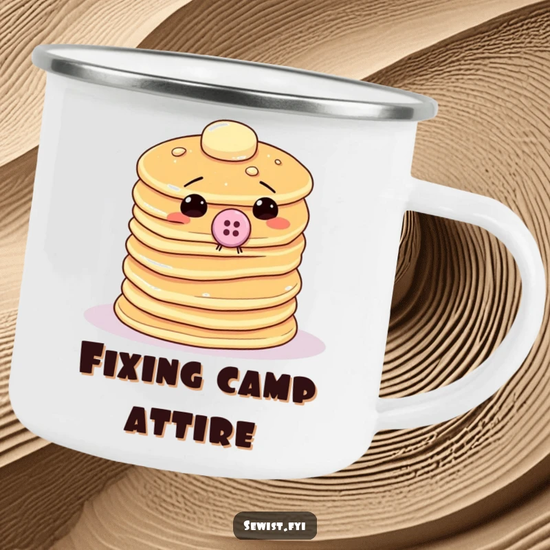 Funny pancake camping mug with a wobbly stack attempting to sew a giant button onto itself, perfect for outdoor use.