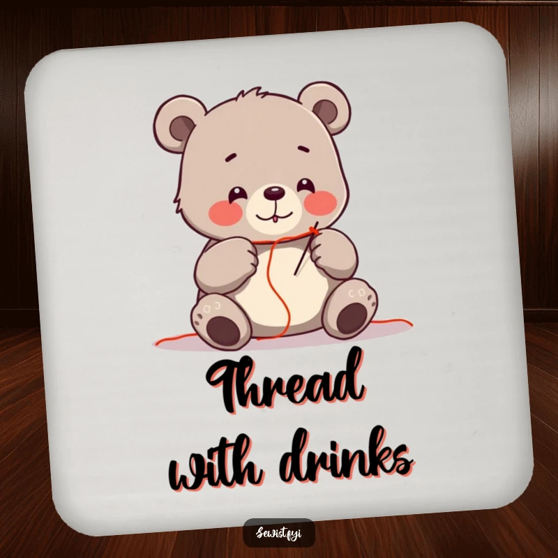 Funny drink coaster featuring a cheerful bear carefully threading a needle with red thread, a crafting accessory.