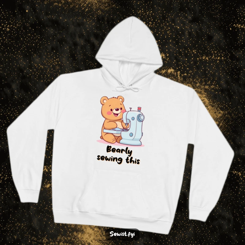 Funny Bear Hoodie: Comfortable hoodie with a happy bear sewing expertly, radiating joy and crafting spirit, gift.