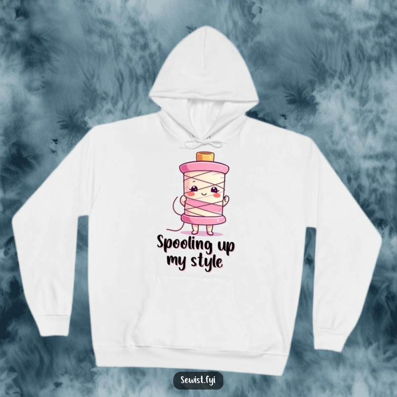 Funny hoodie featuring a character proudly holding a vibrant, colorful sewing spool, perfect for cozy crafting.