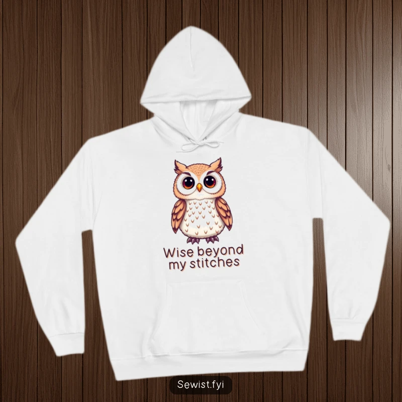 Funny Owl Hoodie with a cute owl admiring a delicate embroidered detail, perfect for cozy crafting and thoughtful appreciation.