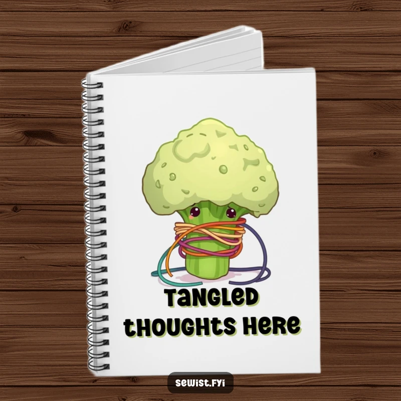 Funny notebook with a clumsy broccoli floret comically tangled in colorful sewing thread, perfect for journaling crafting projects.