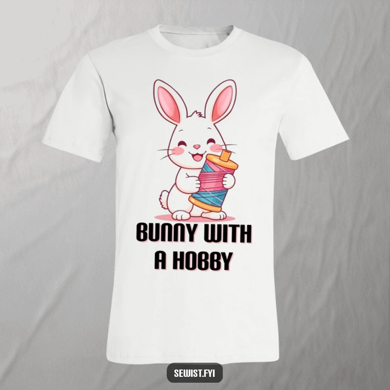 Funny Rabbit T-Shirt: Cheerful rabbit with bright eyes holding a colorful spool of thread, a cute crafting companion.