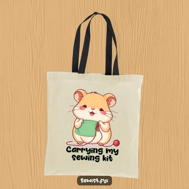 Funny beaming hamster concentrates on sewing with needle and thread, a humorous tote bag for crafters.